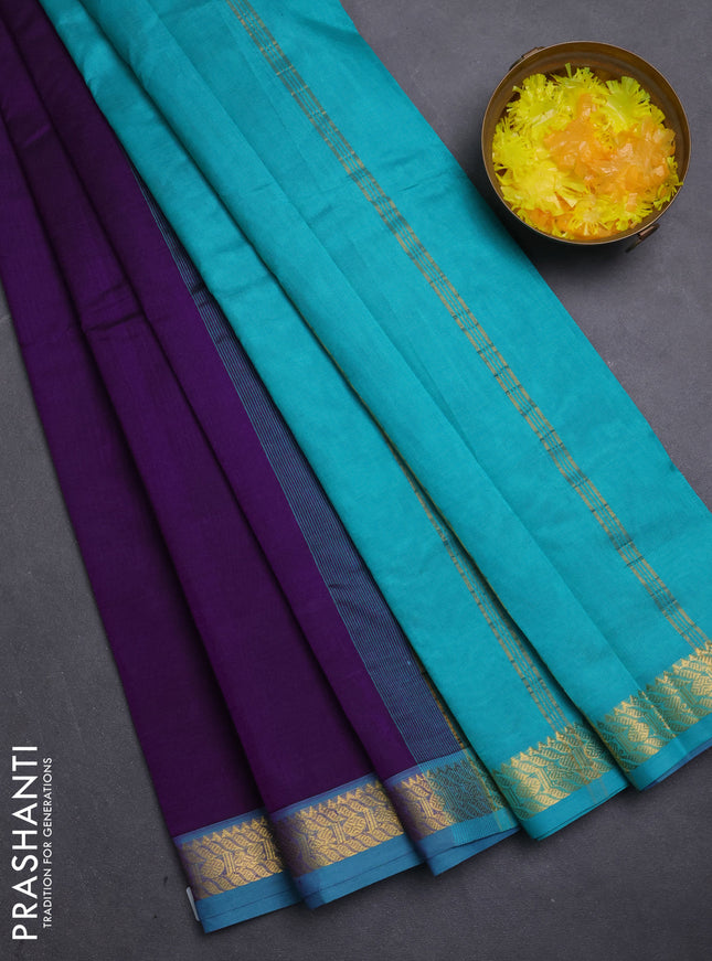 Silk cotton saree purple and teal blue with plain body and zari woven border