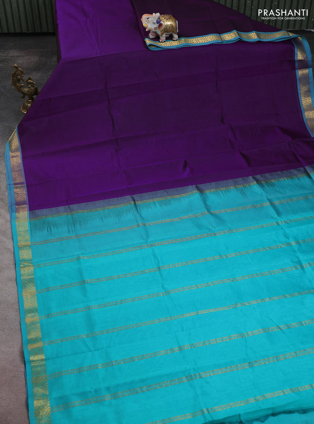 Silk cotton saree purple and teal blue with plain body and zari woven border