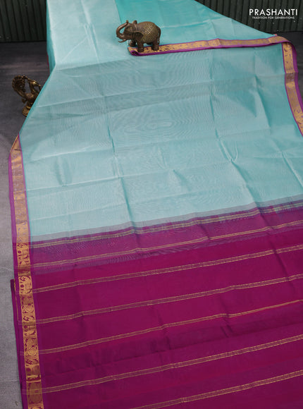 Silk cotton saree teal blue and purple with plain body and zari woven border