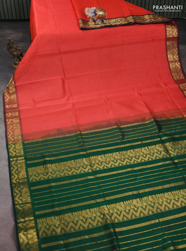Silk cotton saree peach shade and bottle green with plain body and zari woven border