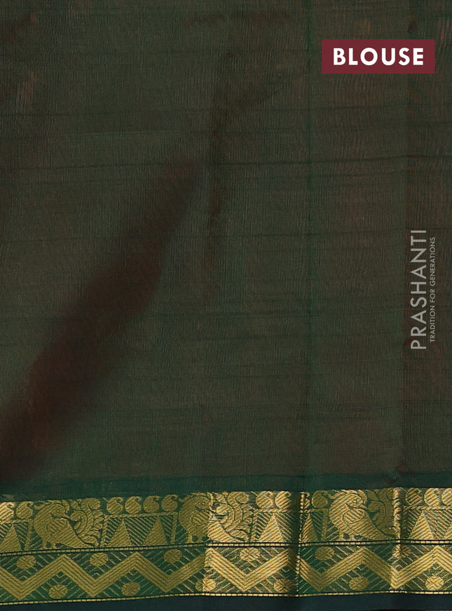 Silk cotton saree peach shade and bottle green with plain body and zari woven border