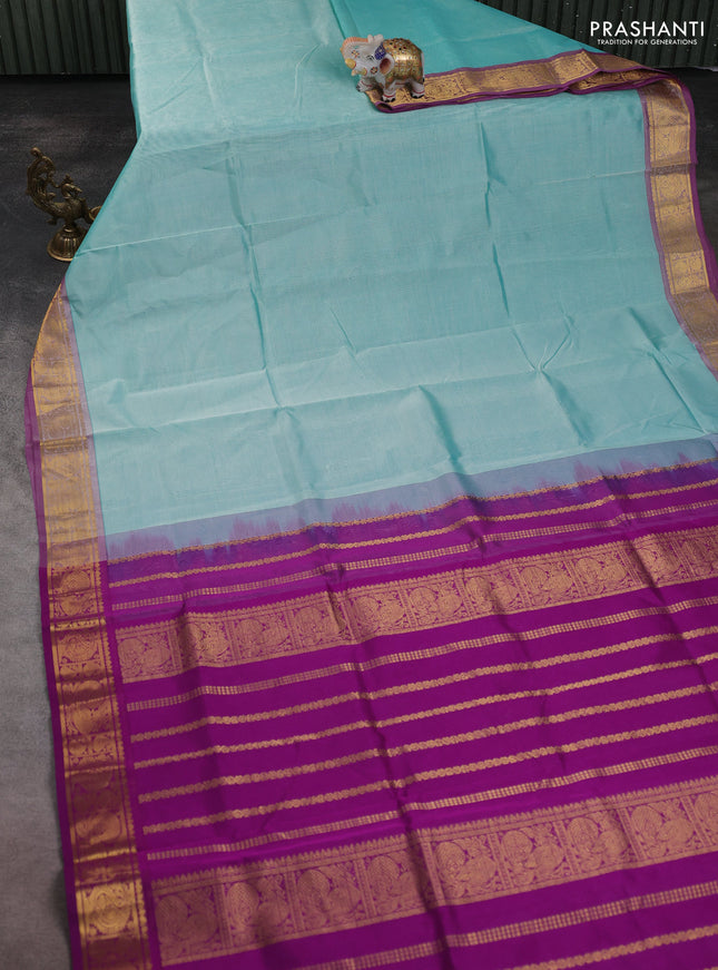 Silk cotton saree teal blue and magenta pink with plain body and annam zari woven border
