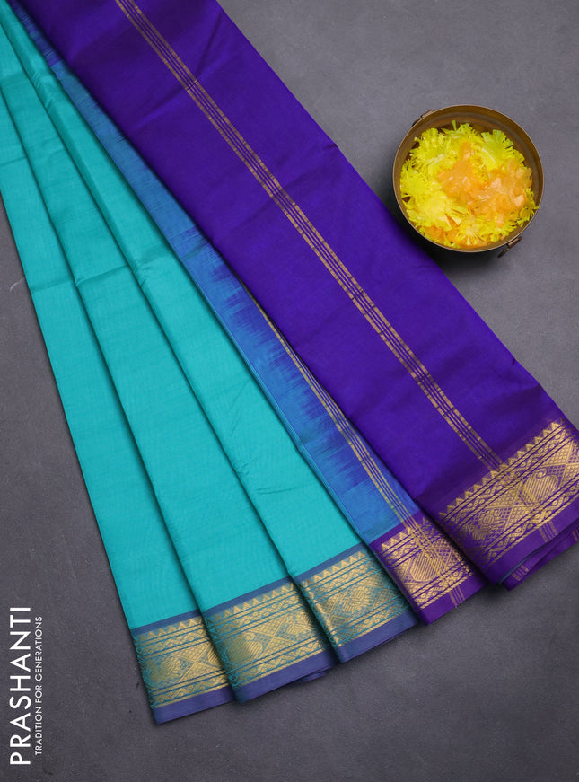 Silk cotton saree teal green shade and violet with plain body and zari woven border