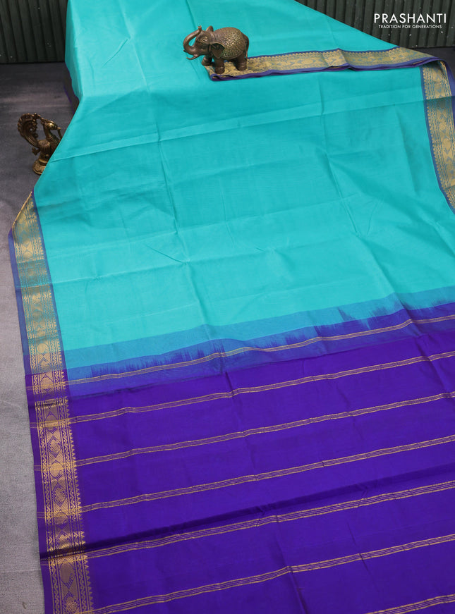 Silk cotton saree teal green shade and violet with plain body and zari woven border