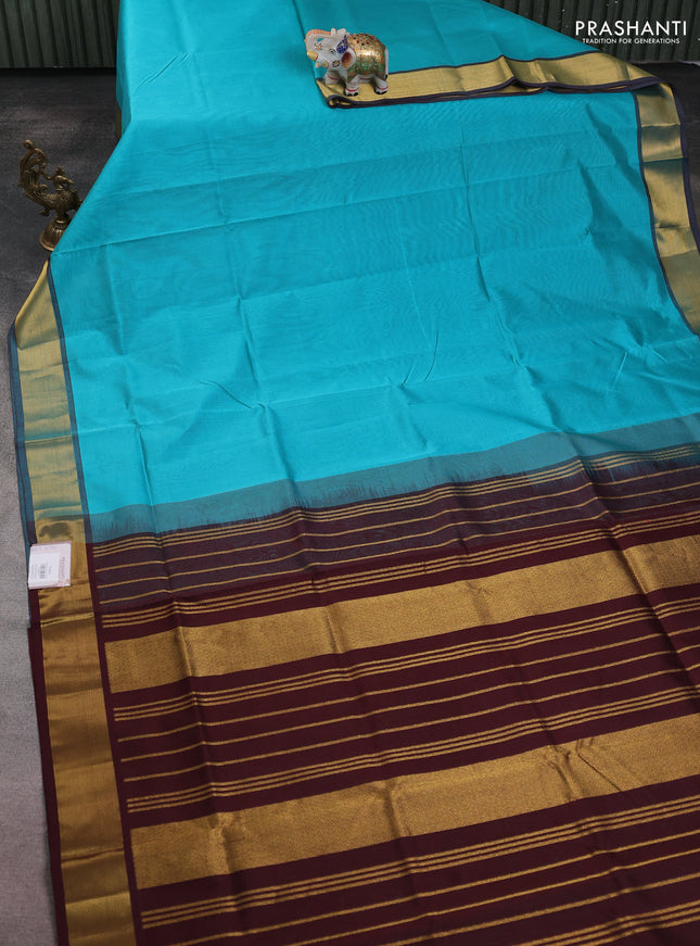 Silk cotton saree teal blue and coffee brown with plain body and zari woven border