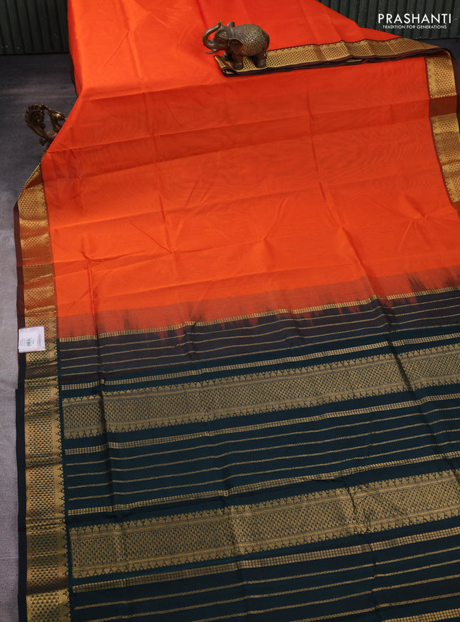 Silk cotton saree orange and bottle green with plain body and zari woven border