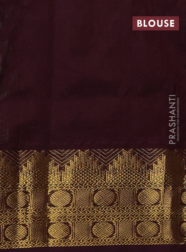 Silk cotton saree metallic green and deep maroon with plain body and zari woven border