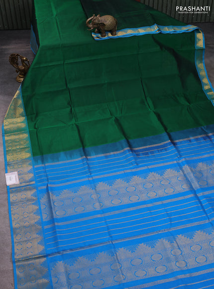 Silk cotton saree green and cs blue with plain body and zari woven border