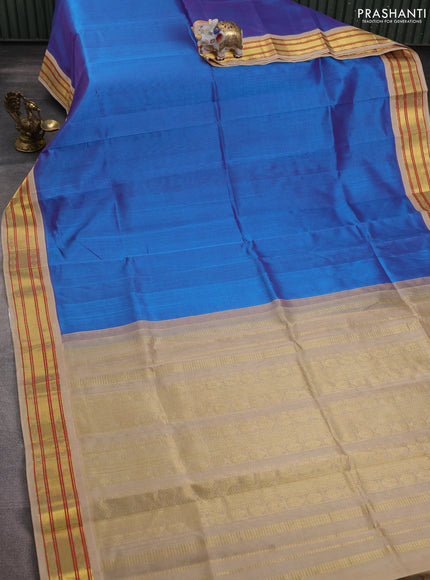 Silk cotton saree dual shade of blue and beige with plain body and zari woven korvai border