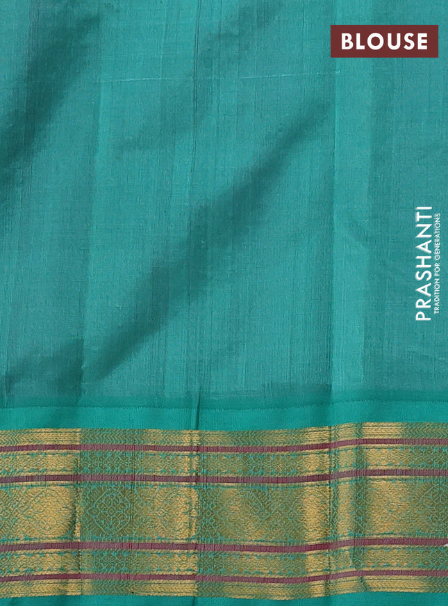 Silk cotton saree purple and teal green with allover zari checks & buttas and zari woven korvai border