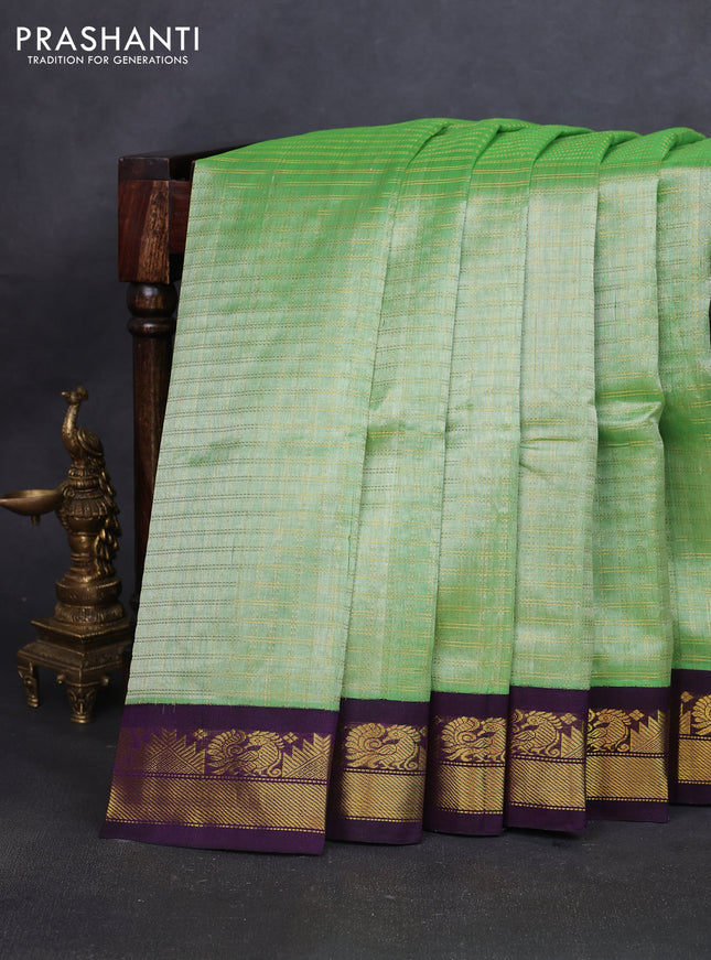 Silk cotton saree pista green and deep purple with allover zari woven checked pattern and zari woven korvai border