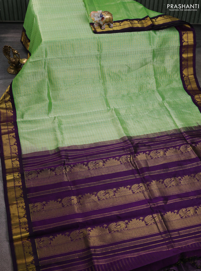 Silk cotton saree pista green and deep purple with allover zari woven checked pattern and zari woven korvai border