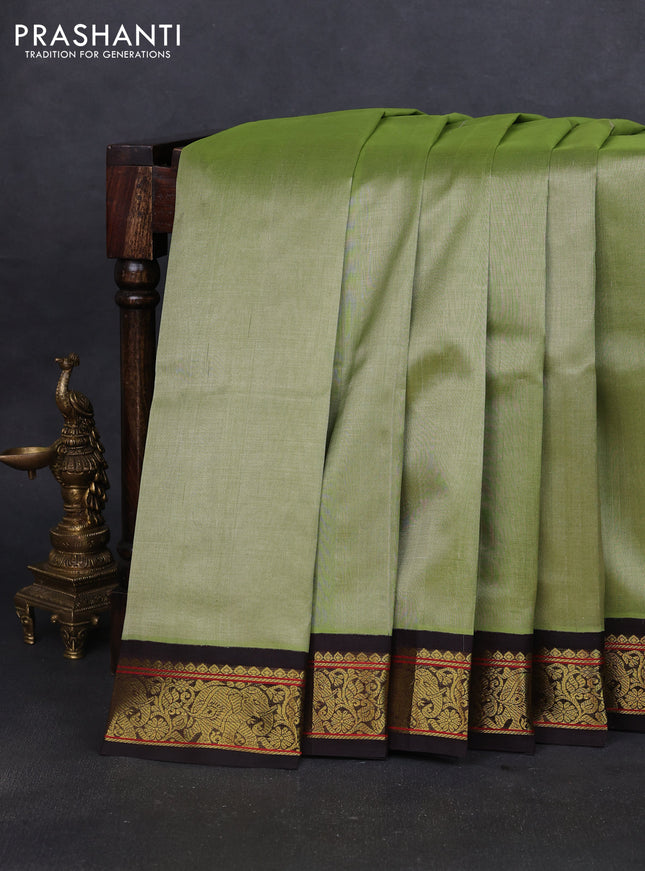Silk cotton saree pastel green and coffee brown with plain body and elephant zari woven korvai border