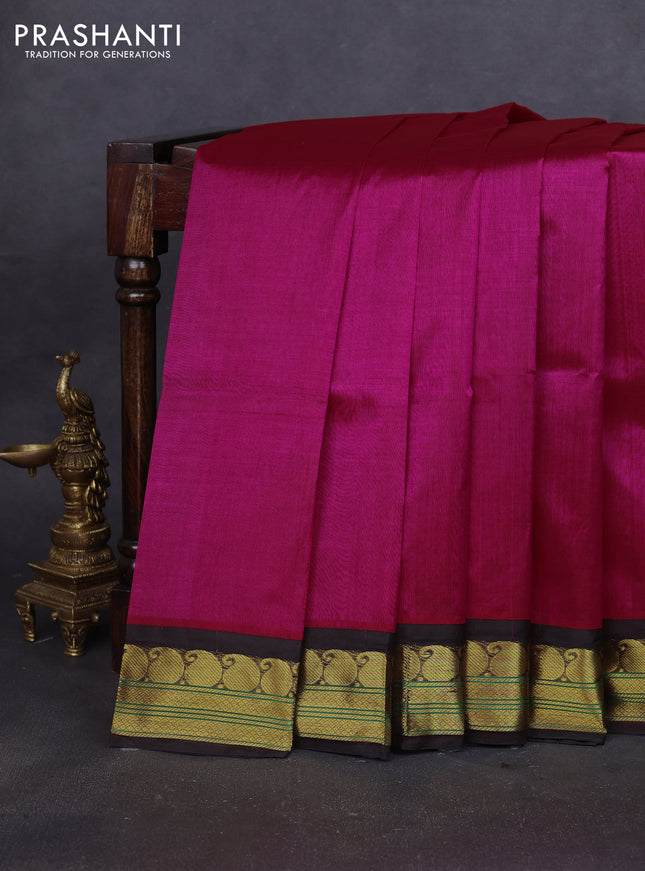 Silk cotton saree rani pink and deep coffee brown with plain body and paisley zari woven korvai border