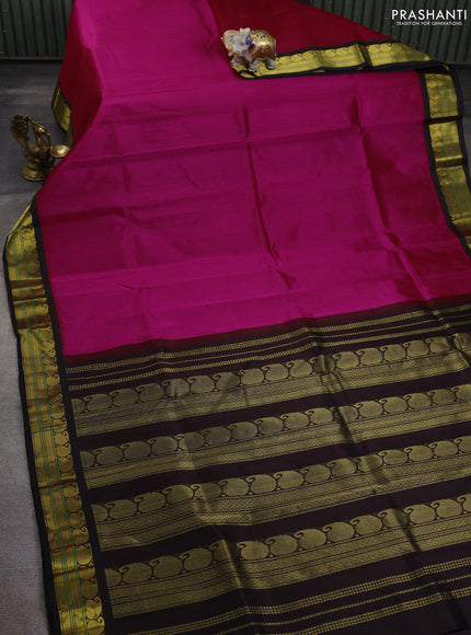Silk cotton saree rani pink and deep coffee brown with plain body and paisley zari woven korvai border