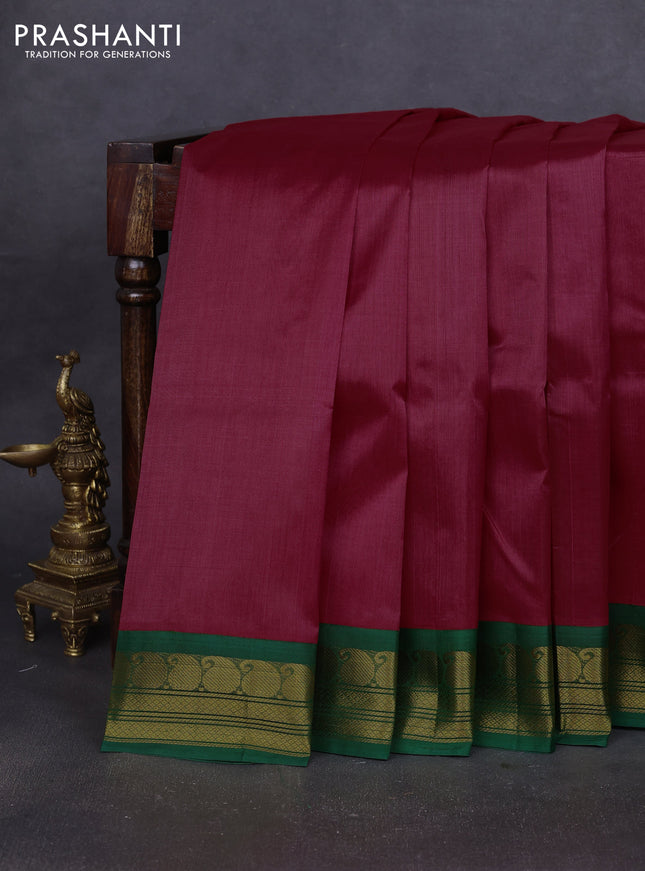 Silk cotton saree pink and green with plain body and paisley zari woven korvai border
