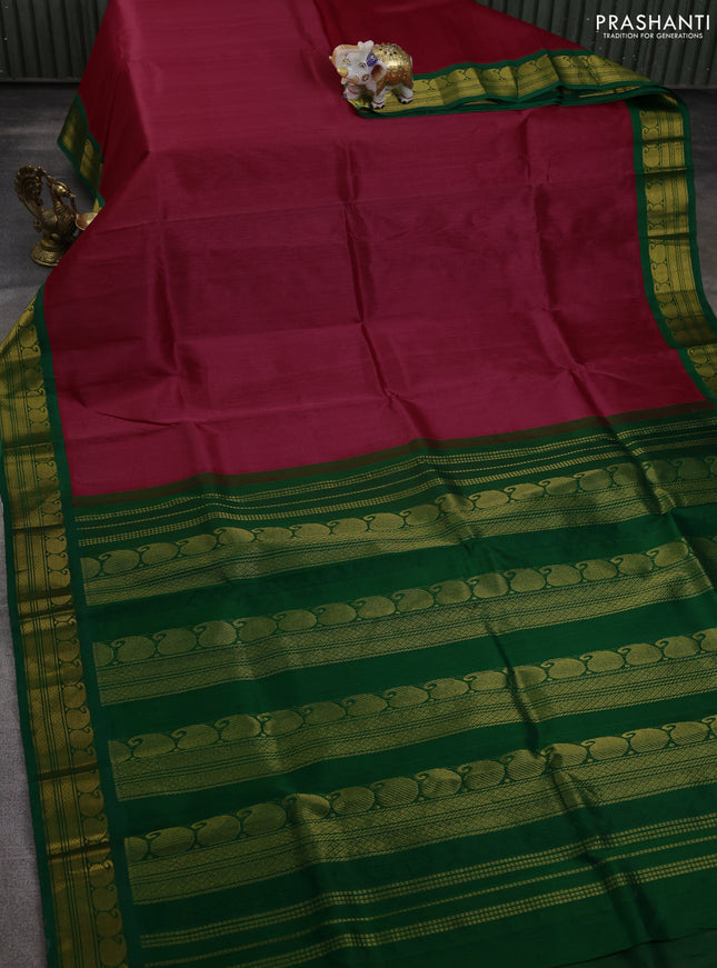 Silk cotton saree pink and green with plain body and paisley zari woven korvai border