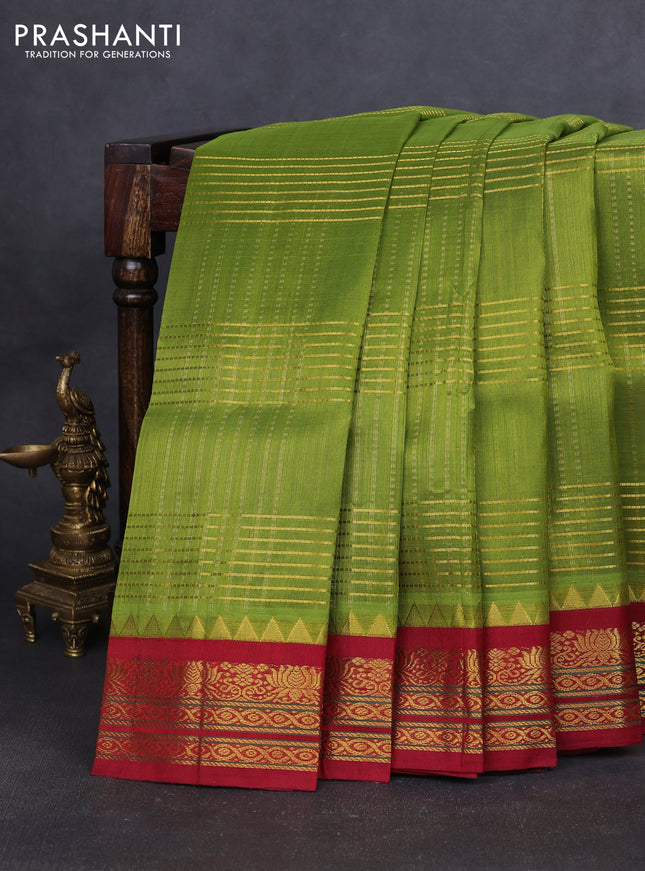 Silk cotton saree light green and maroon with allover zari woven checked pattern and temple design zari woven korvai border