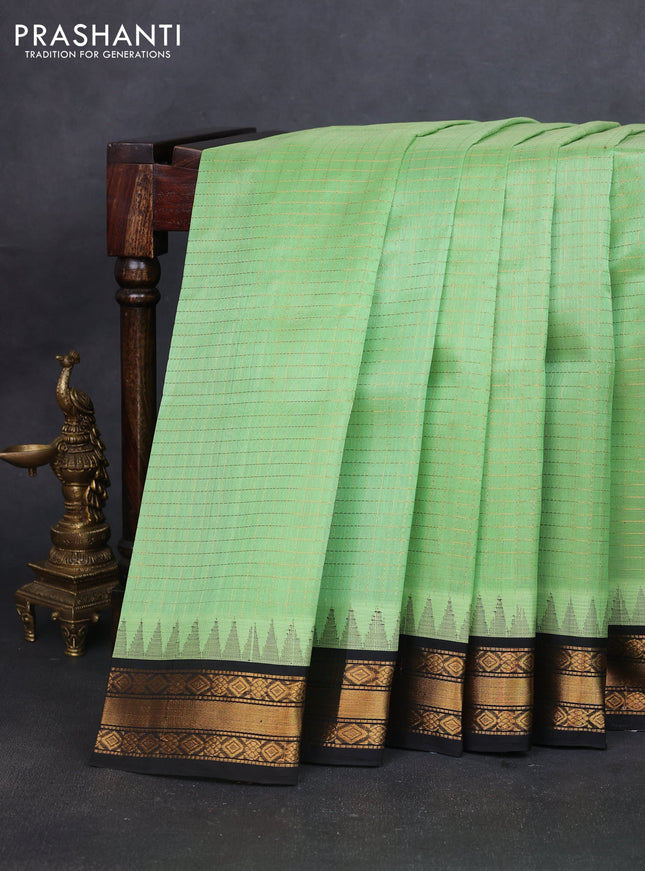 Silk cotton saree pista green and black with allover zari woven checked pattern and temple design zari woven korvai border