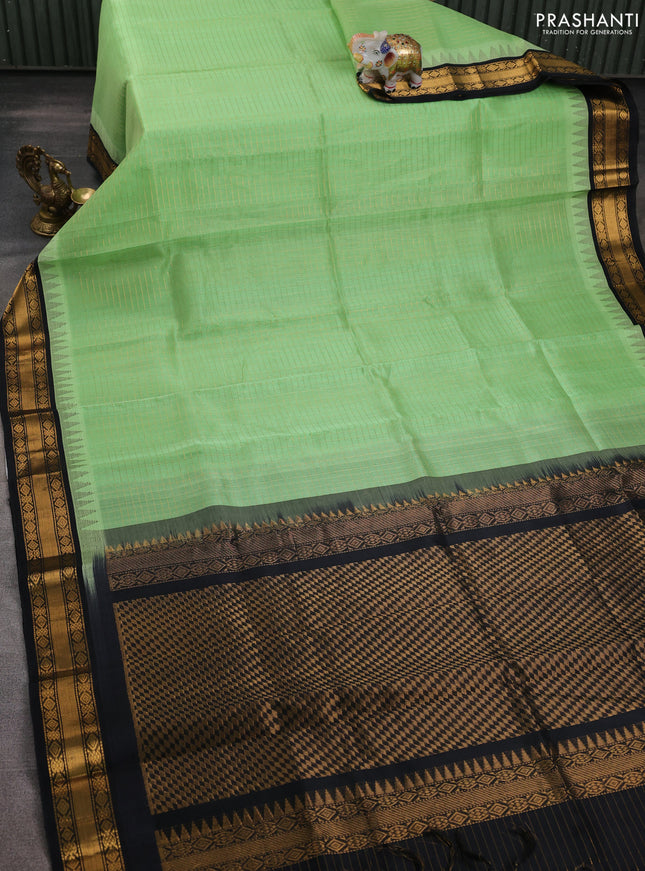 Silk cotton saree pista green and black with allover zari woven checked pattern and temple design zari woven korvai border