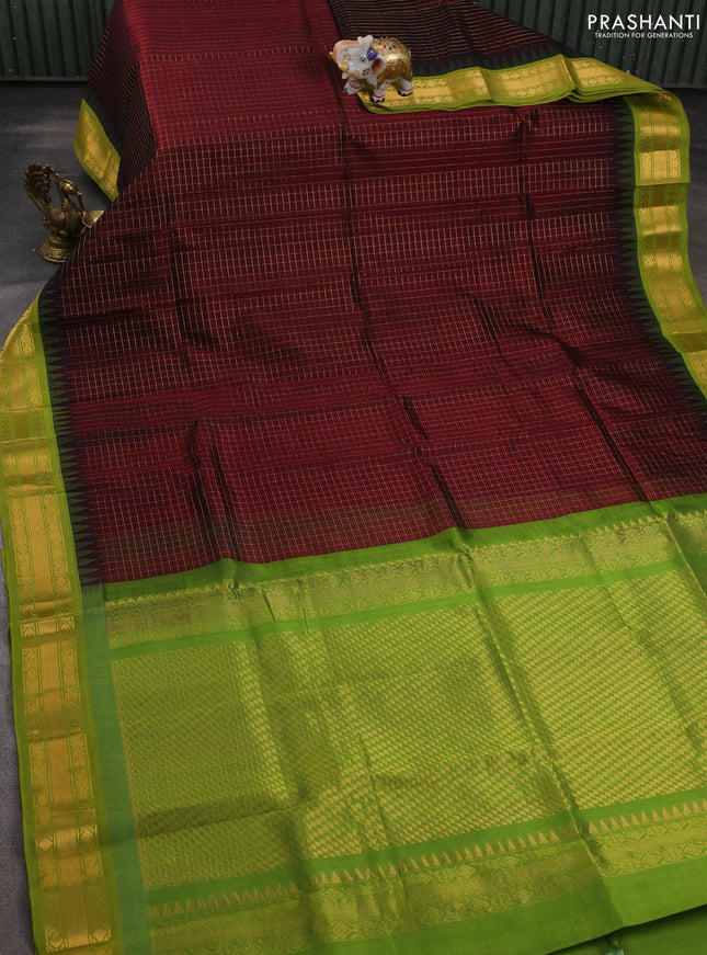 Silk cotton saree deep maroon and light green with allover small zari checked pattern and temple design zari woven korvai border