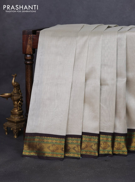 Silk cotton saree pastel grey and coffee brown with plain body and zari woven korvai border
