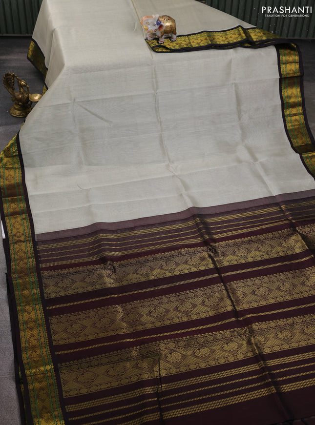 Silk cotton saree pastel grey and coffee brown with plain body and zari woven korvai border