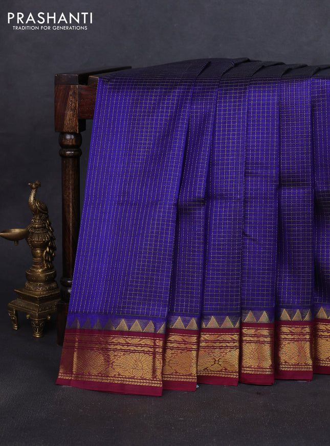 Silk cotton saree blue and wine shade with allover small zari checked pattern and annam zari woven korvai border