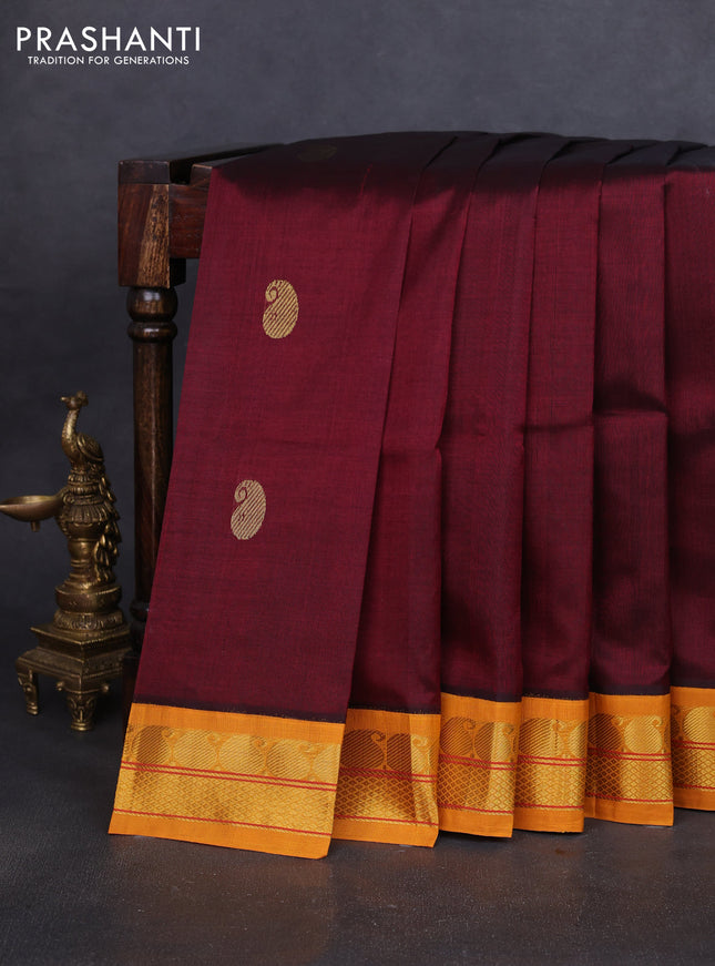 Silk cotton saree maroon and mustard yellow with paisley zari woven buttas and paisley zari woven korvai border