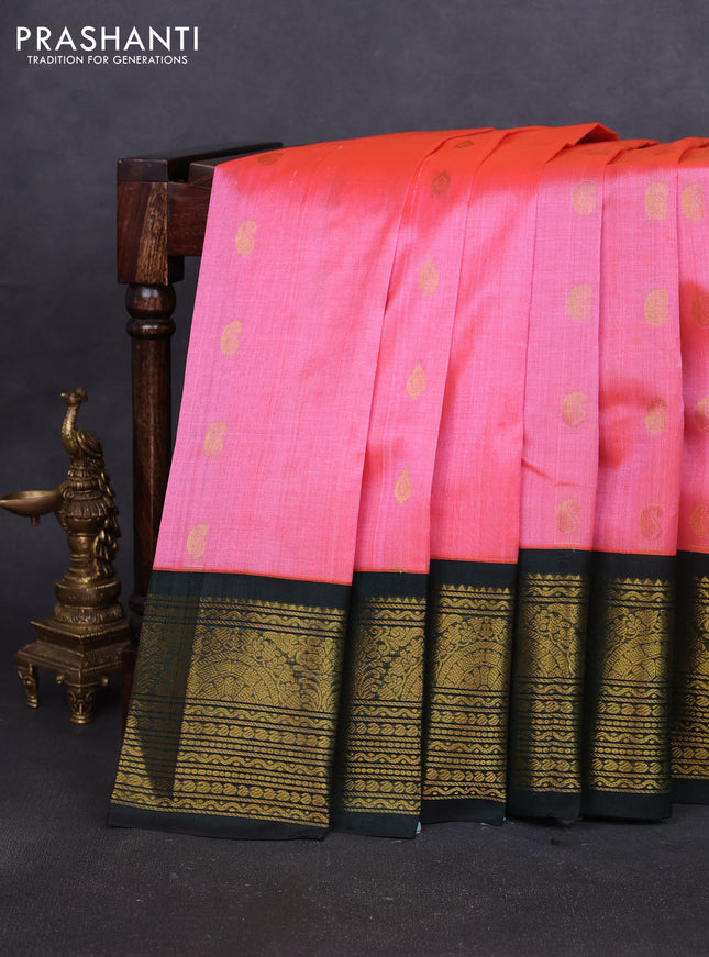 Silk cotton saree peach pink and bottle green with paisley zari woven buttas and long zari woven korvai border