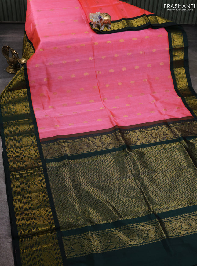 Silk cotton saree peach pink and bottle green with paisley zari woven buttas and long zari woven korvai border