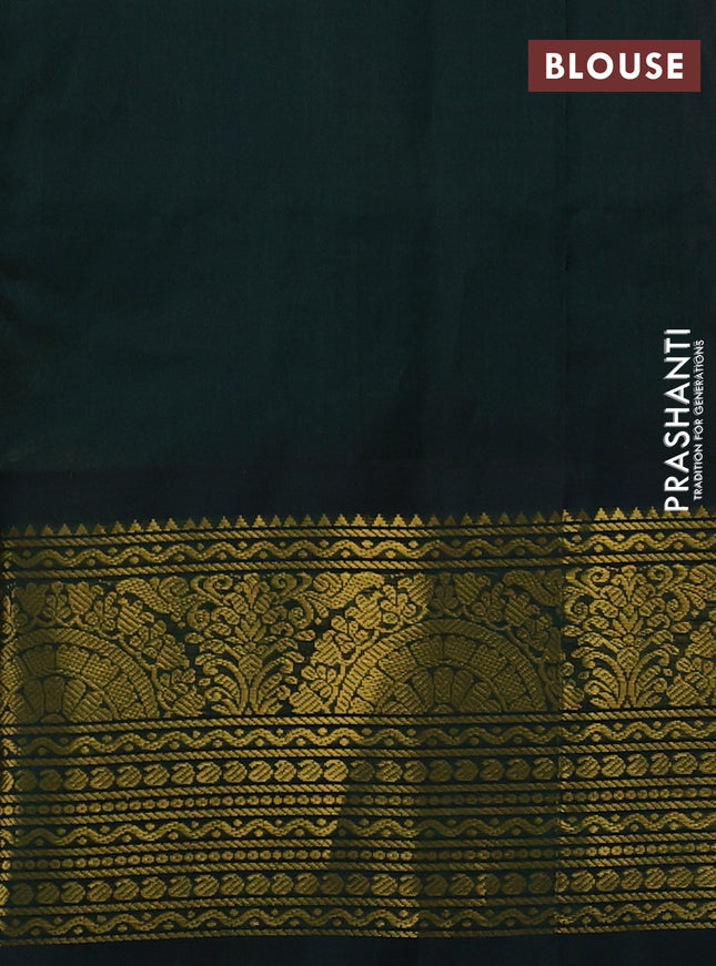 Silk cotton saree peach pink and bottle green with paisley zari woven buttas and long zari woven korvai border