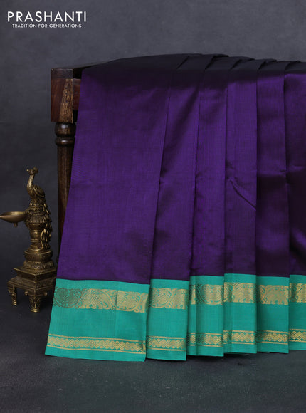 Silk cotton saree violet and teal green with plain body and rettapet zari woven korvai border