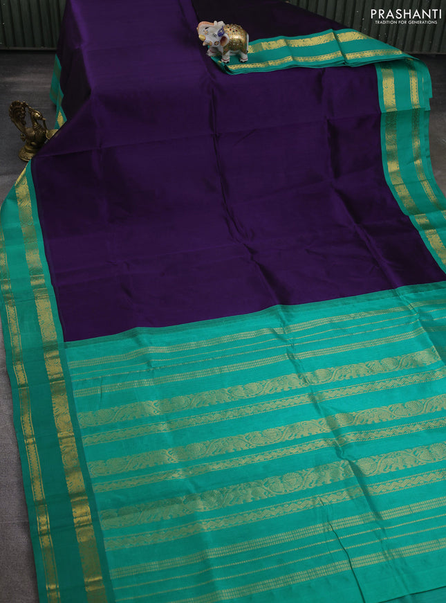 Silk cotton saree violet and teal green with plain body and rettapet zari woven korvai border