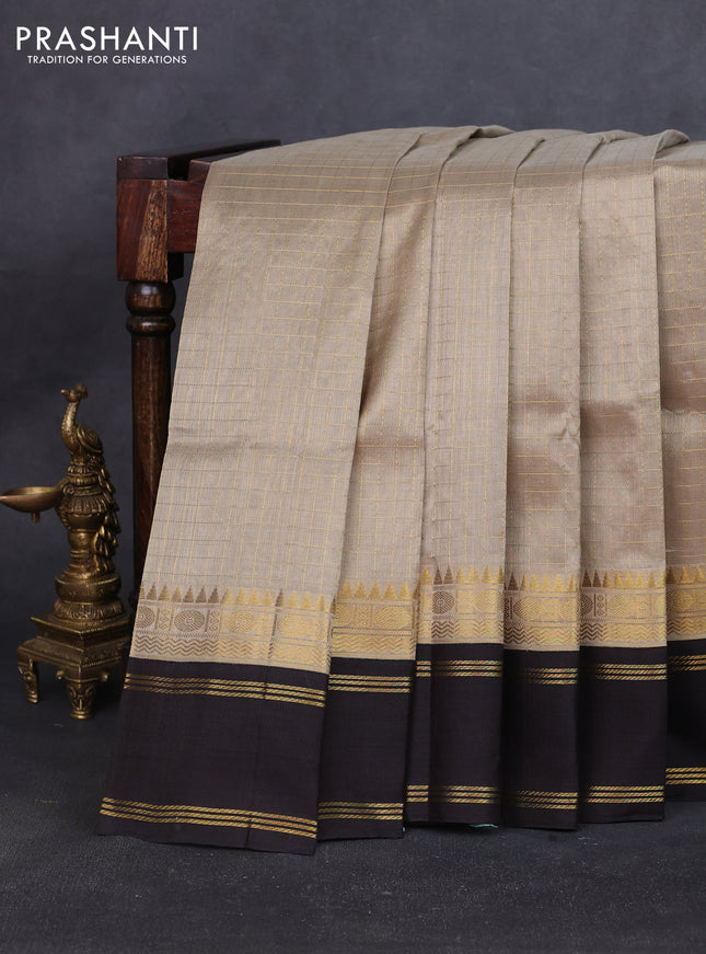 Silk cotton saree beige and deep coffee brown with allover zari woven checked pattern and long rettapet zari woven border