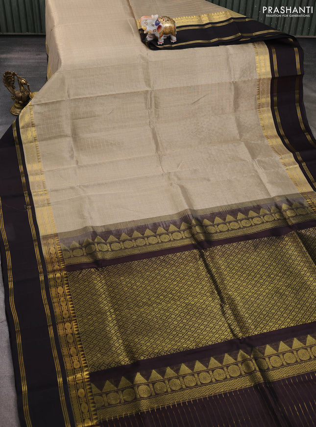 Silk cotton saree beige and deep coffee brown with allover zari woven checked pattern and long rettapet zari woven border