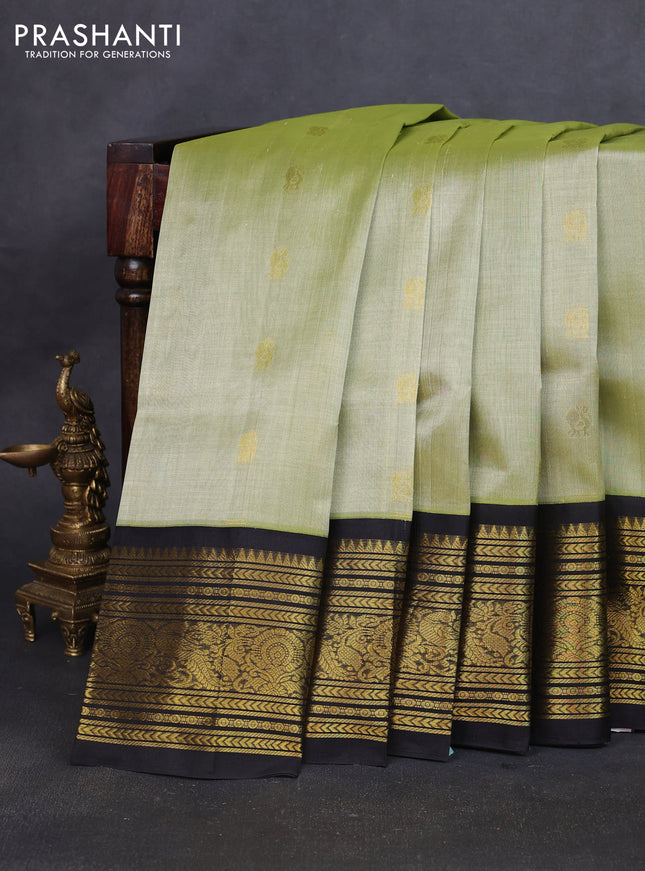 Silk cotton saree pista green and black with zari woven buttas and long zari woven korvai border