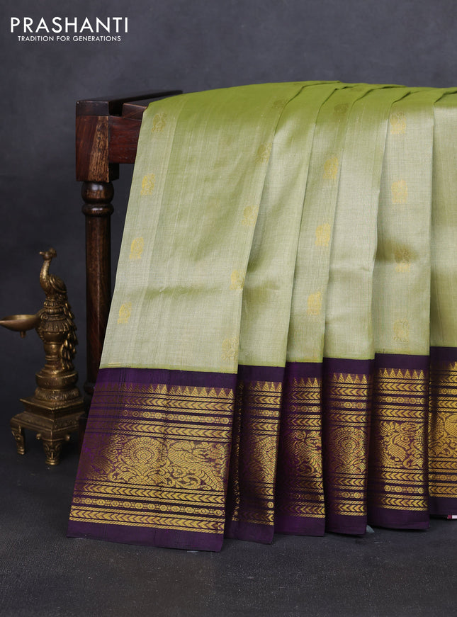 Silk cotton saree mild pita green and purple with zari woven buttas and long zari woven korvai border