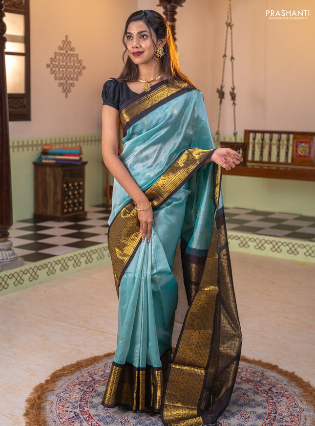 Silk cotton saree teal blue and dark blue with zari woven buttas and long zari woven korvai border