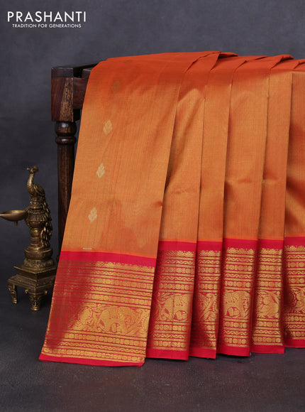 Silk cotton saree dark mustard and red with zari woven buttas and long zari woven korvai border