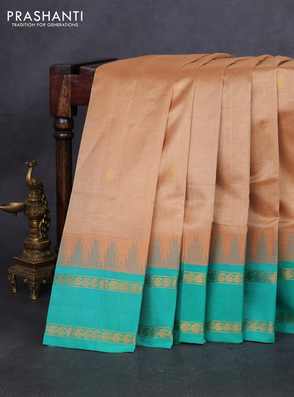 Silk cotton saree sandal and teal green shade with paisley zari woven buttas and temple design rettapet zari woven korvai border