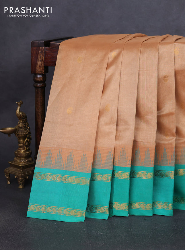 Silk cotton saree sandal and teal green shade with paisley zari woven buttas and temple design rettapet zari woven korvai border