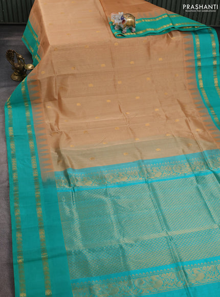 Silk cotton saree sandal and teal green shade with paisley zari woven buttas and temple design rettapet zari woven korvai border