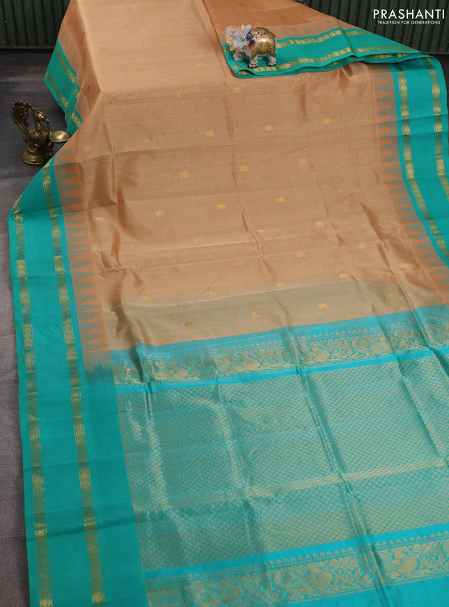 Silk cotton saree sandal and teal green shade with paisley zari woven buttas and temple design rettapet zari woven korvai border