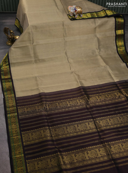 Silk cotton saree khaki shade and deep coffee brown with plain body and annam zari woven korvai border