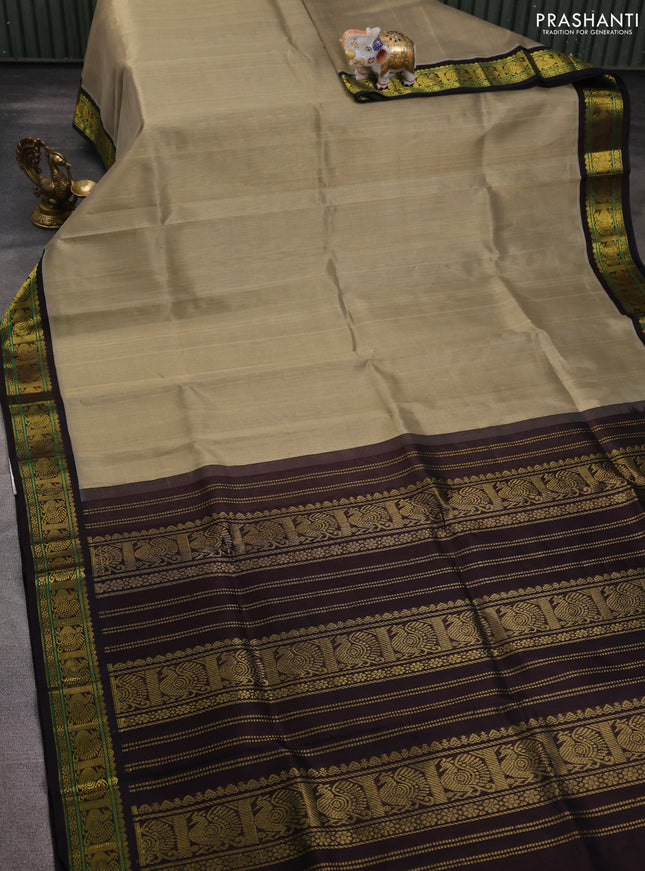 Silk cotton saree khaki shade and deep coffee brown with plain body and annam zari woven korvai border