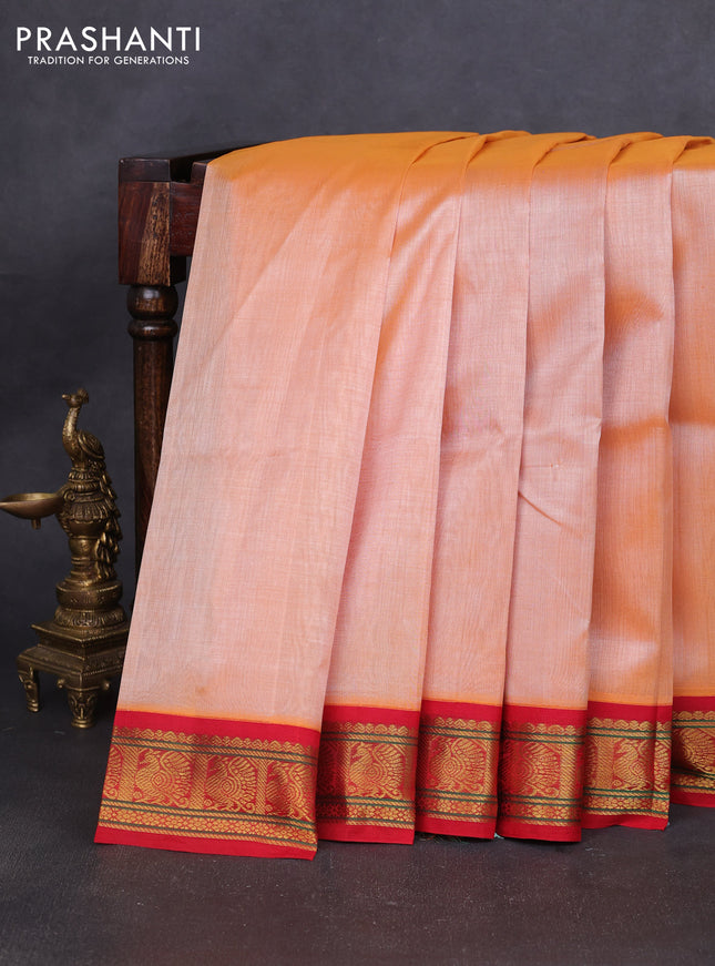 Silk cotton saree pale orange and red with plain body and annam zari woven korvai border