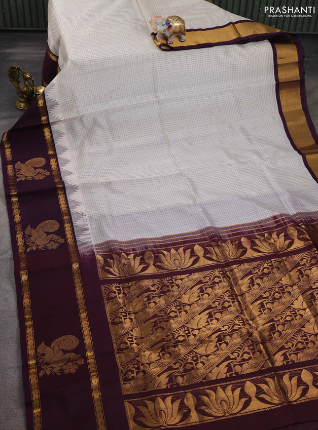 Silk cotton saree cream and wine shade with allover small checked pattern and temple design zari woven butta border