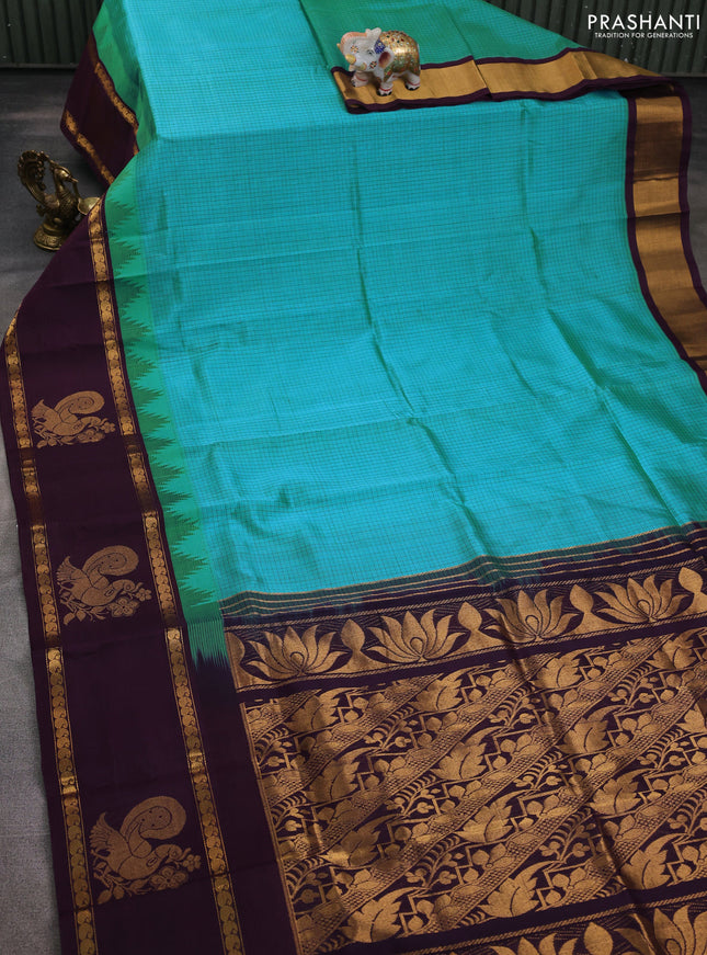 Silk cotton saree teal blue and jamun shade with allover small checked pattern and temple design zari woven butta border