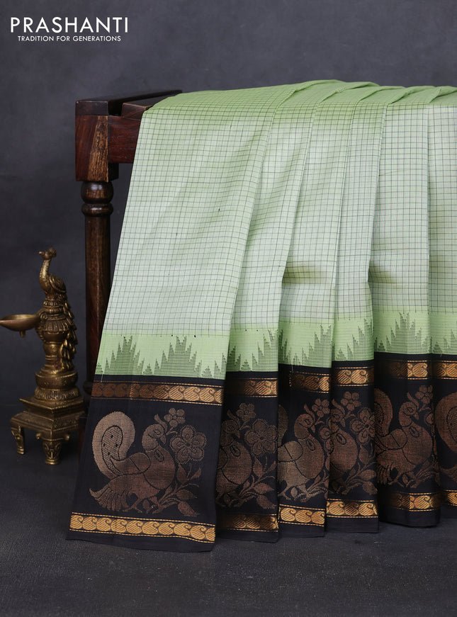 Silk cotton saree pista green and black with allover small checked pattern and temple design zari woven butta border